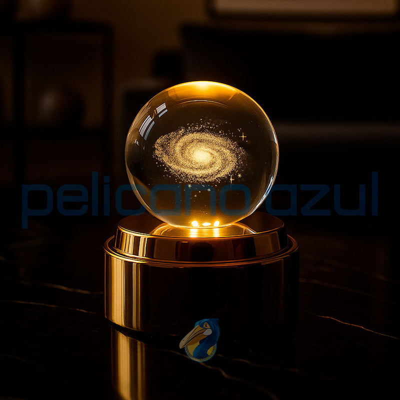 luminária giratória com galaxia dourada iluminada em base dourada para decoracao moderna